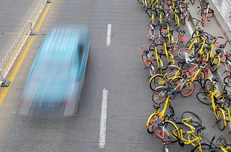 Shared bicycles piled up on the roadside