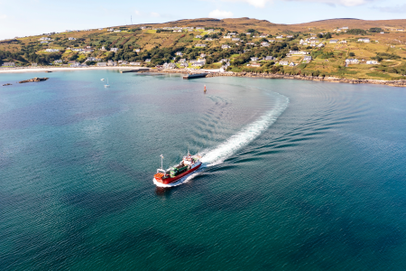 An image of a ferry leaving an island port. An image of a ferry leaving an island port.