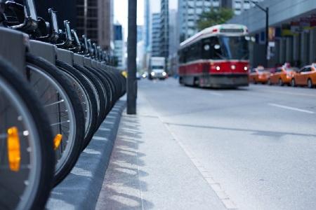 Tram passes a bikeshare docking point